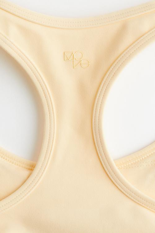 Medium support sports bra with softmove™ - light yellow