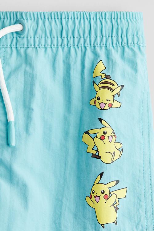 Printed swim shorts - turquoise/pokémon