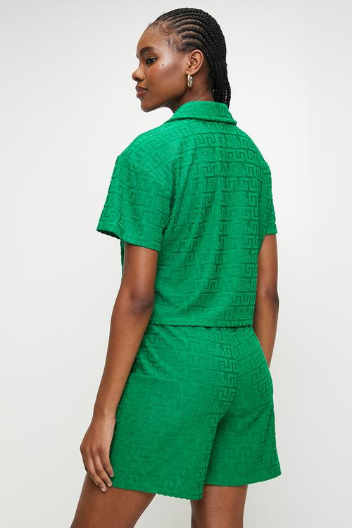 Ladies tessa embossed logo top with collar - emerald green