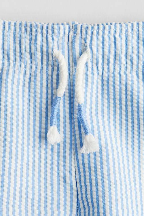 Patterned swim shorts - light blue striped