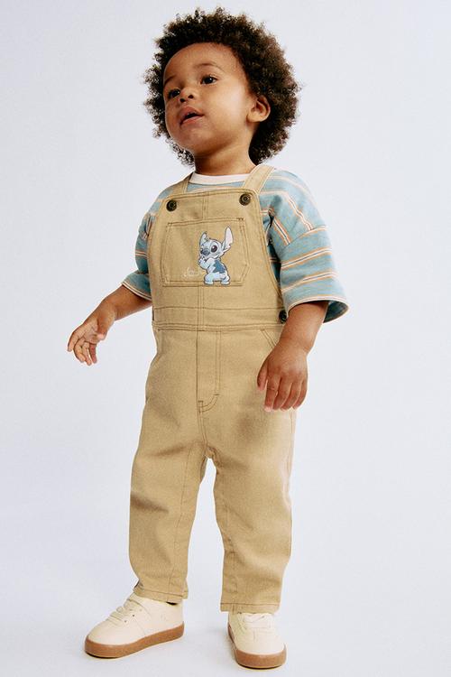 Motif-detail twill dungarees - beige/lilo & stitch 