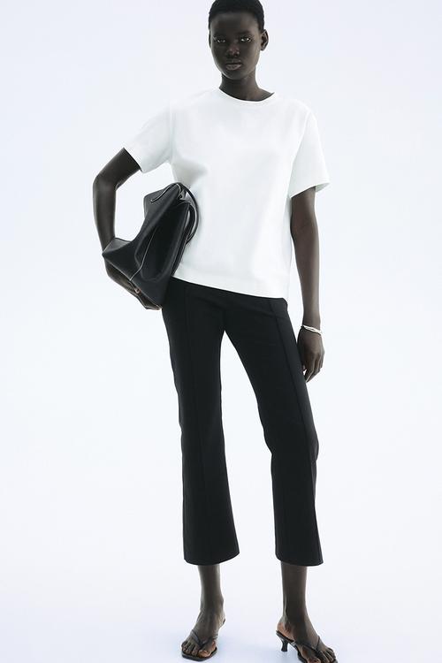 Flared crease-front trousers - black