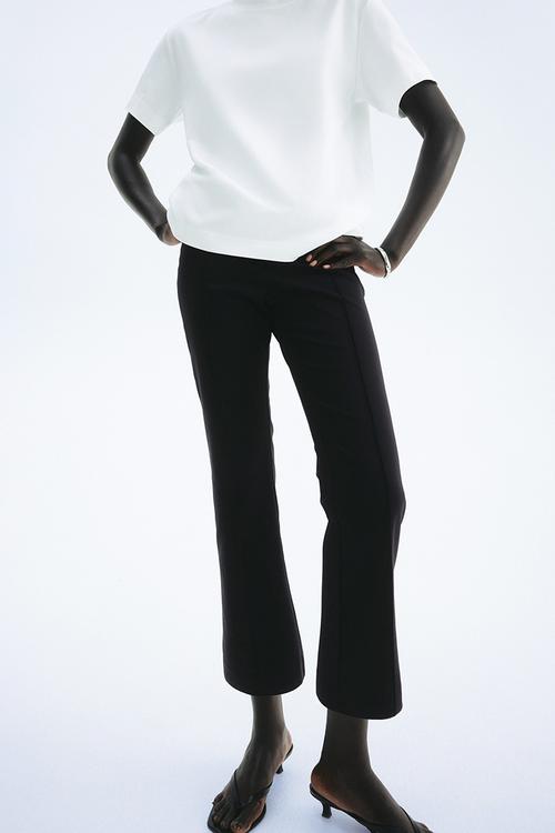 Flared crease-front trousers - black