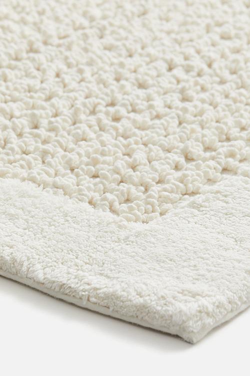 Tufted cotton bath mat - white