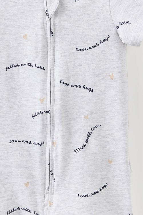 The Short Sleeve Zip Romper -  Snow Marley/Love & Hugs