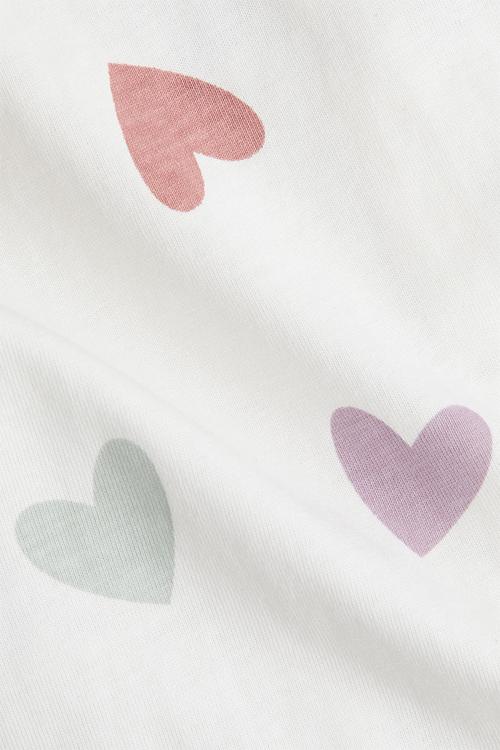 Patterned sleepsuit - white hearts