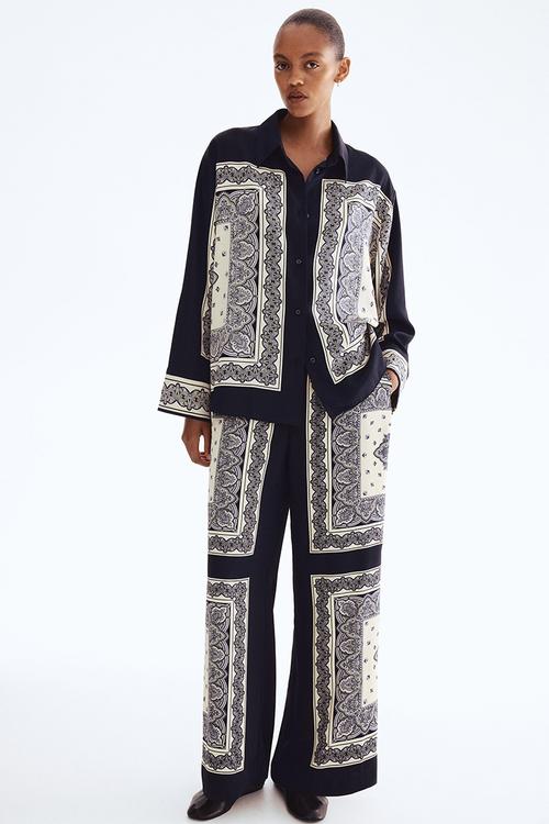 Straight trousers - navy blue/patterned 