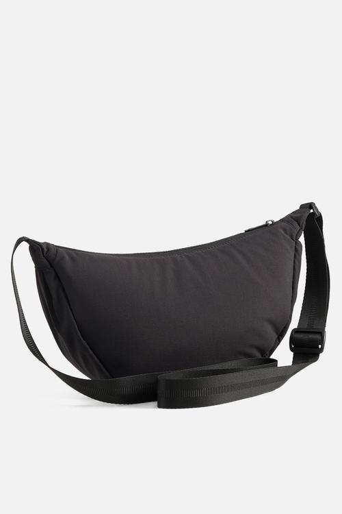 Her half moon bag- puma black
