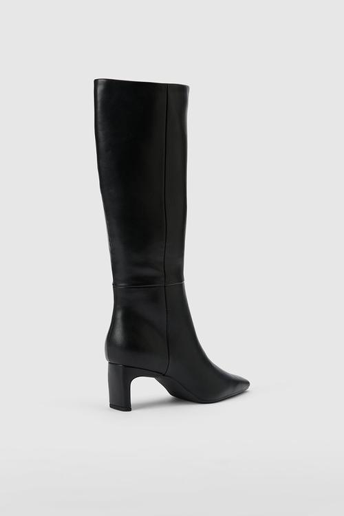 Callie Knee Length Chisel Toe Boot In Black