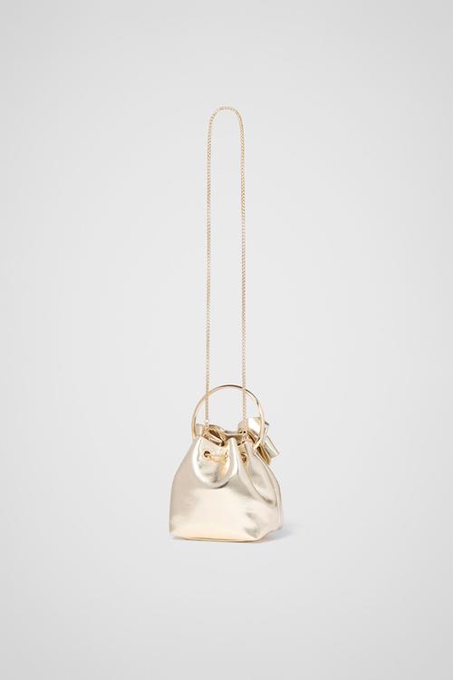 Petra Bow Metal Handle Clutch In Gold