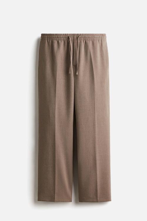 Relaxed fit trousers - beige marl