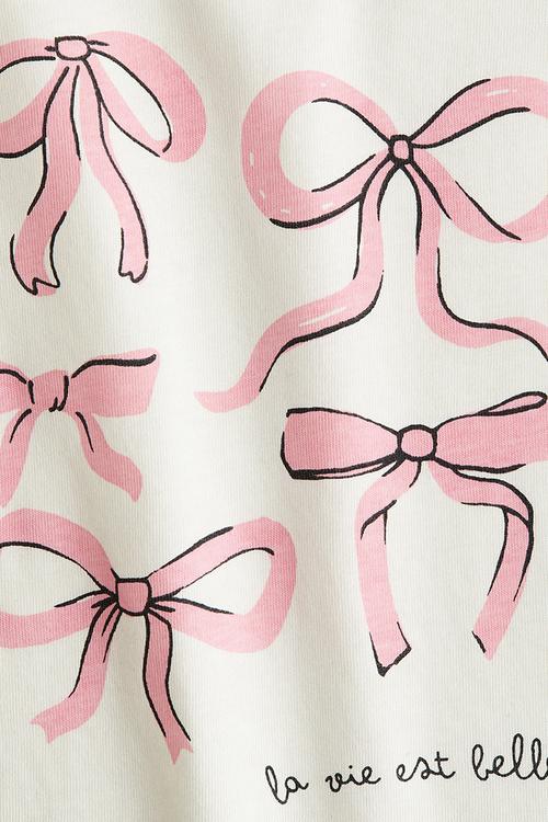 Printed flutter-sleeved top - white/bows