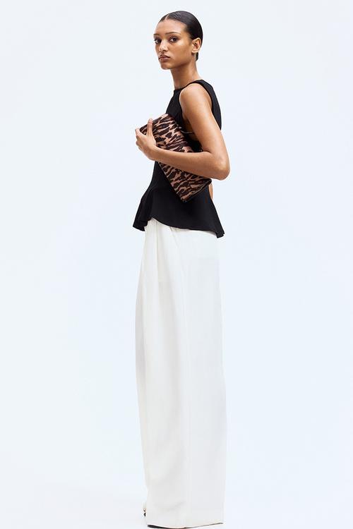 Sleeveless peplum top - black