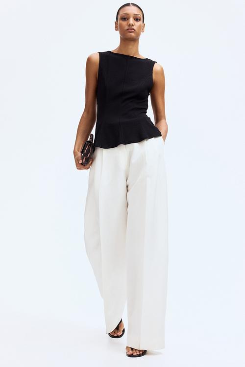 Sleeveless peplum top - black