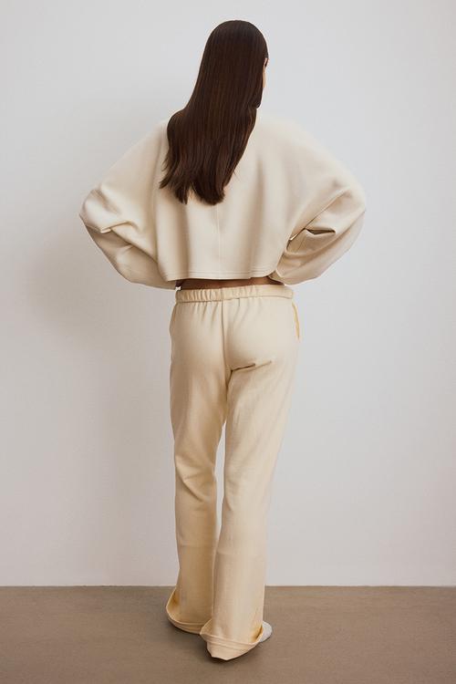 Flared sports sweatpants - light apricot