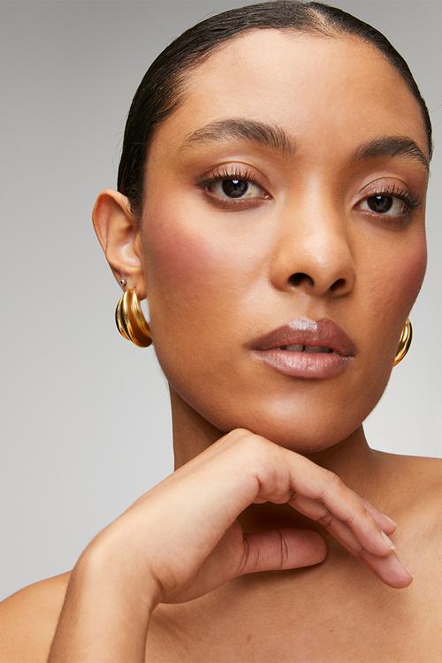 Modern twisted hoop earrings  - gold