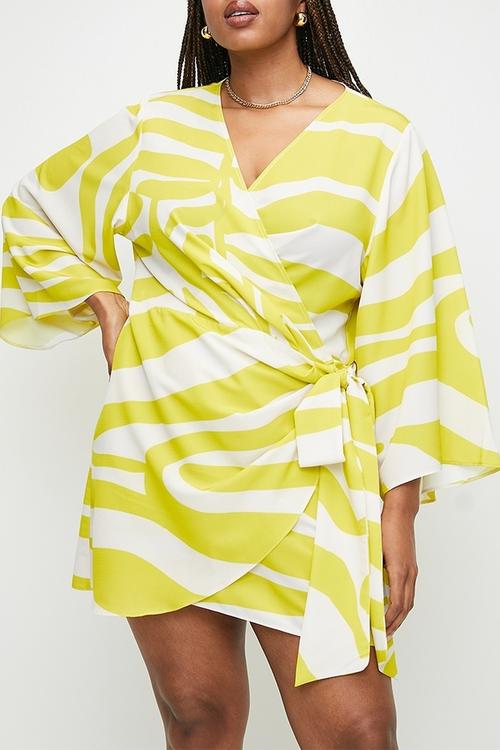 Plus exaggerated sleeve mini wrap dress - yellow graded zebra.