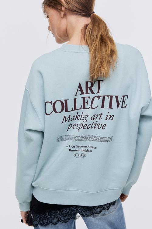 Text-motif sweatshirt - light turquoise/art collective