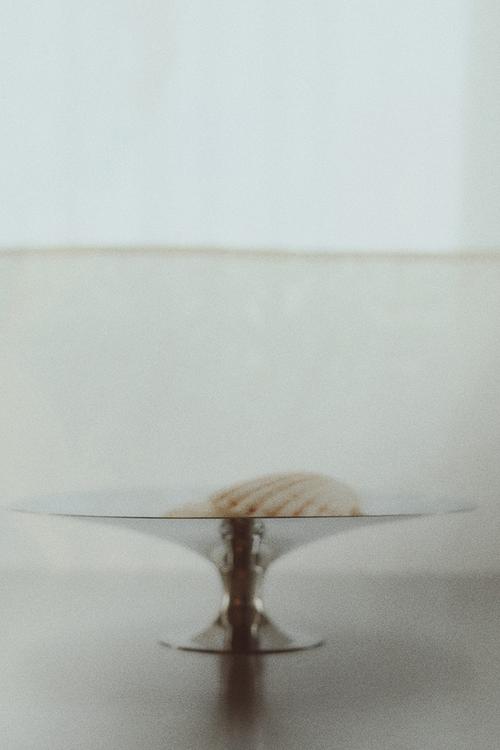 Footed stainless steel bowl - silver-coloured