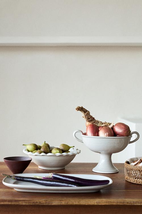 Footed reactive-glaze serving bowl - white