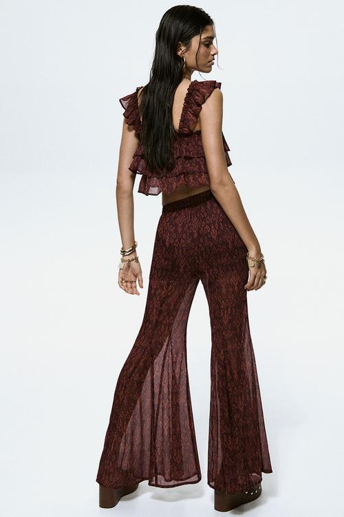 Flared crinkled trousers - burgundy/patterned