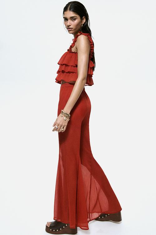 Flared crinkled trousers - red