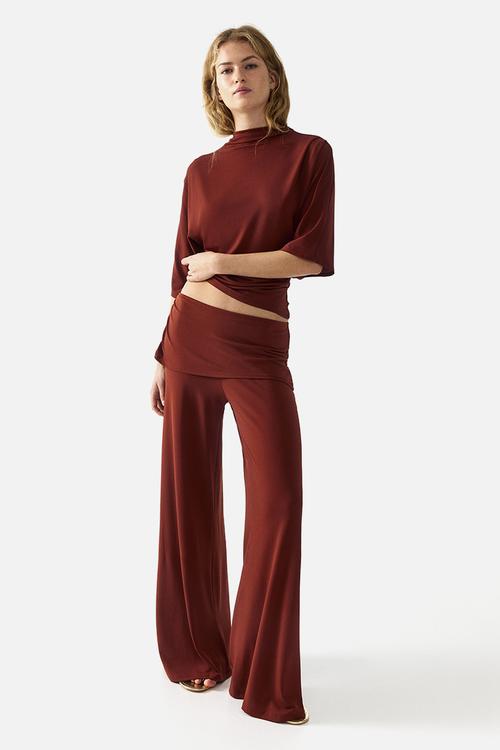 Draped fine-knit trousers - rust red