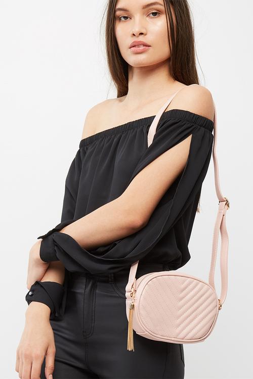 Quilted cross body bag with tassel trim