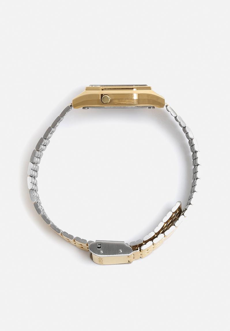 gold casio watch on wrist