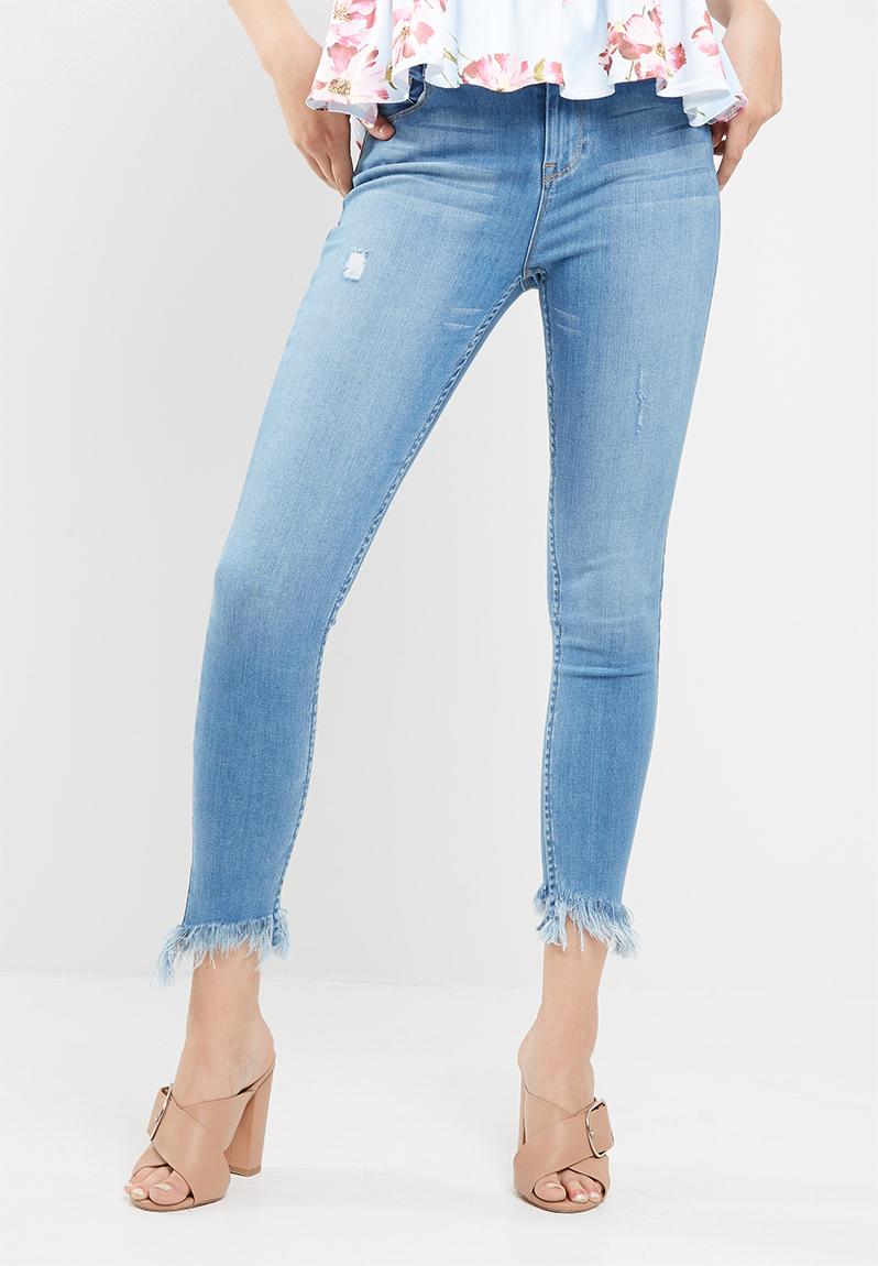 Slanted frayed hem mid rise skinny medium blue dailyfriday Jeans