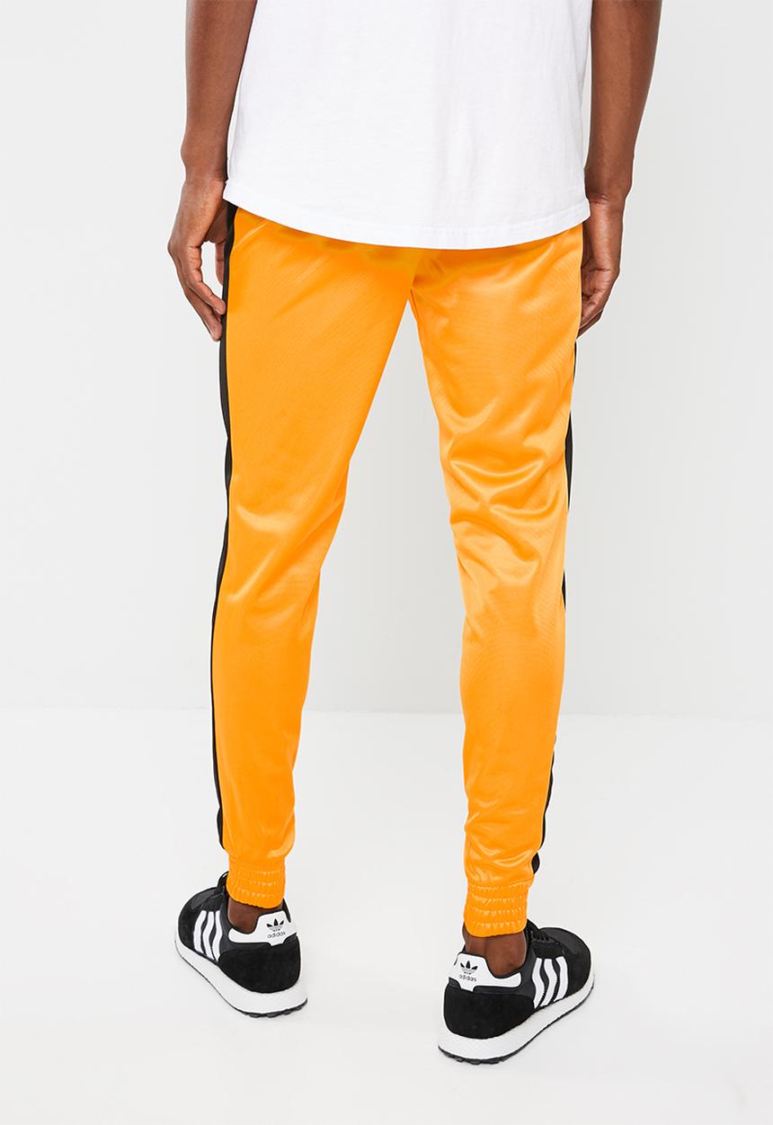 Superbalist - Slim side stripe tricot pant - orange and black