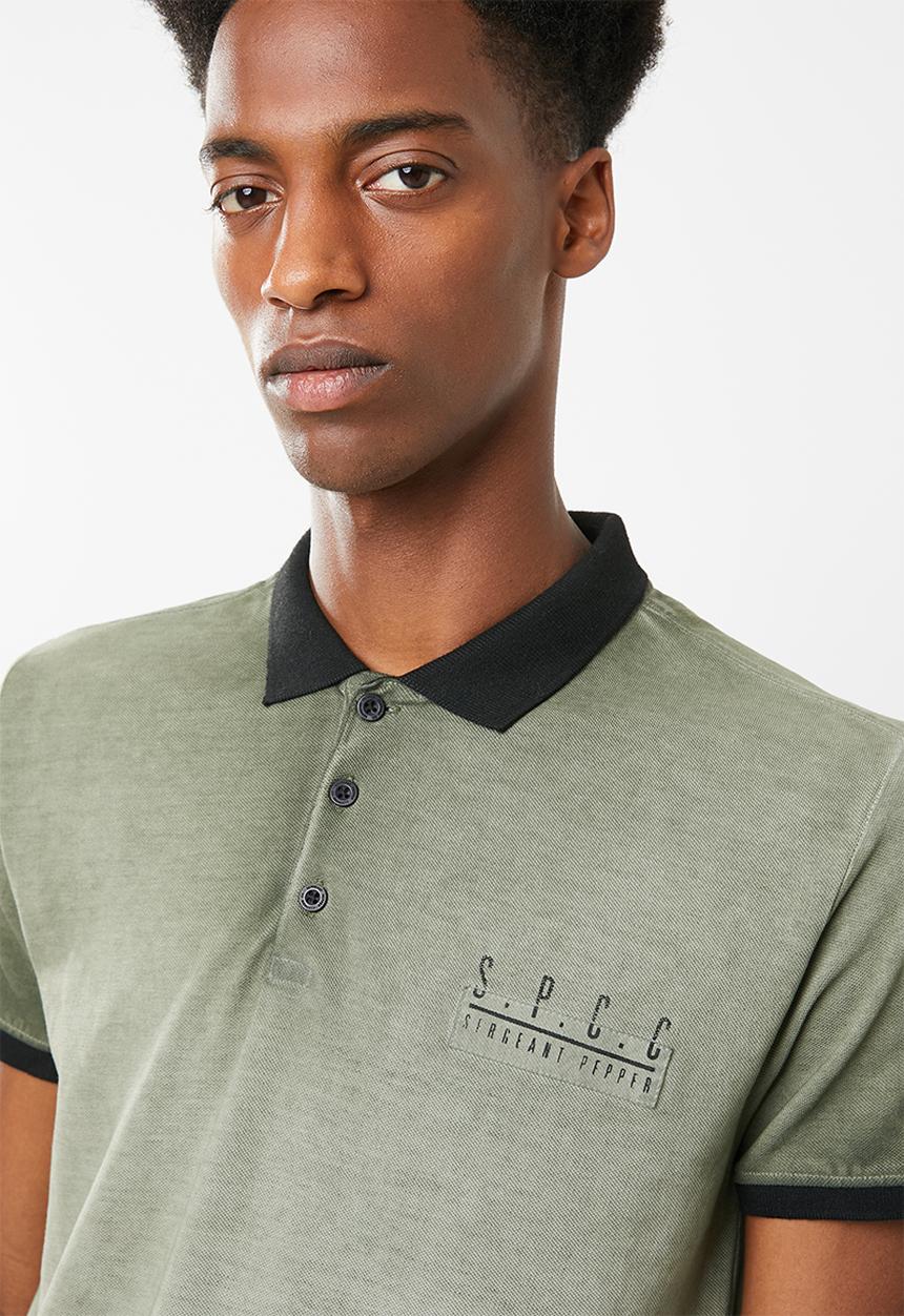 S.P.C.C - Dirty dye pique golfer with binding - green & black 