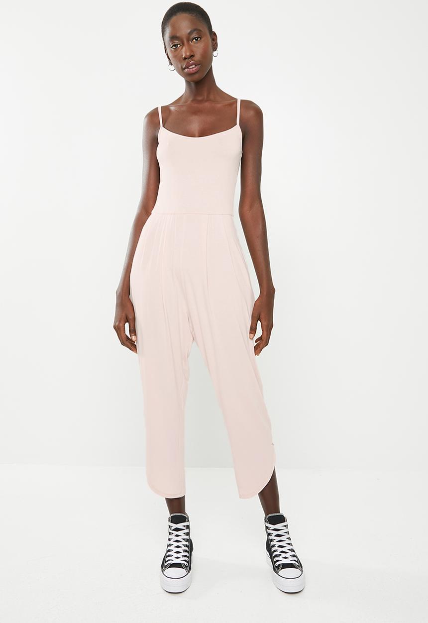 Superbalist - Strappy yoga jumpsuit with pockets at the hip - pink