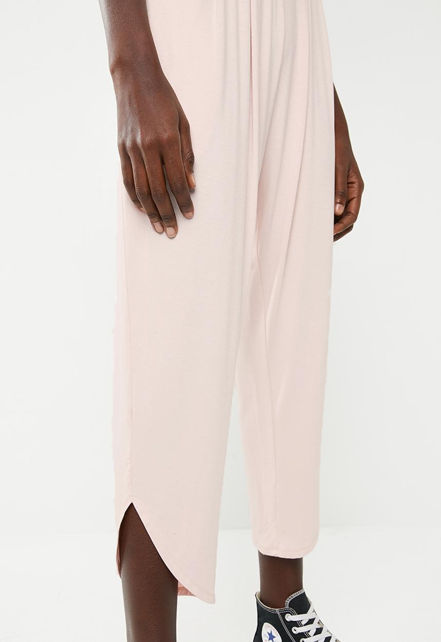 Superbalist - Strappy yoga jumpsuit with pockets at the hip - pink