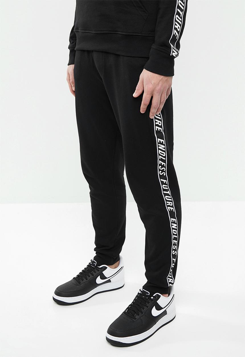 Superbalist - Slim fit printed tape sweat pant - black