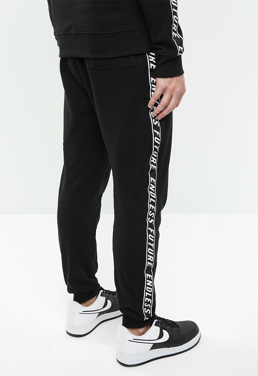 Superbalist - Slim fit printed tape sweat pant - black