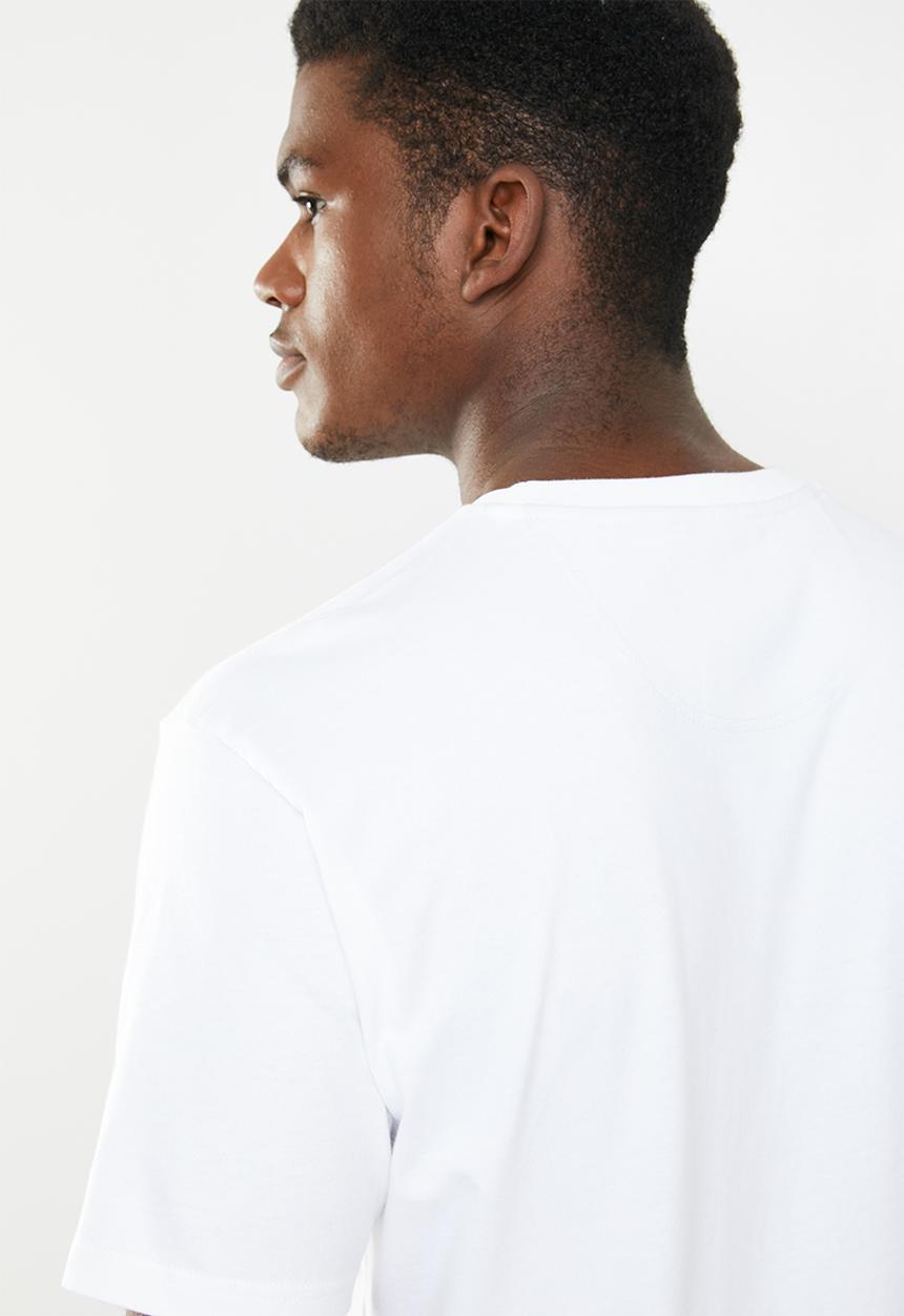 New Balance  - Essentials dark jungle tee - white