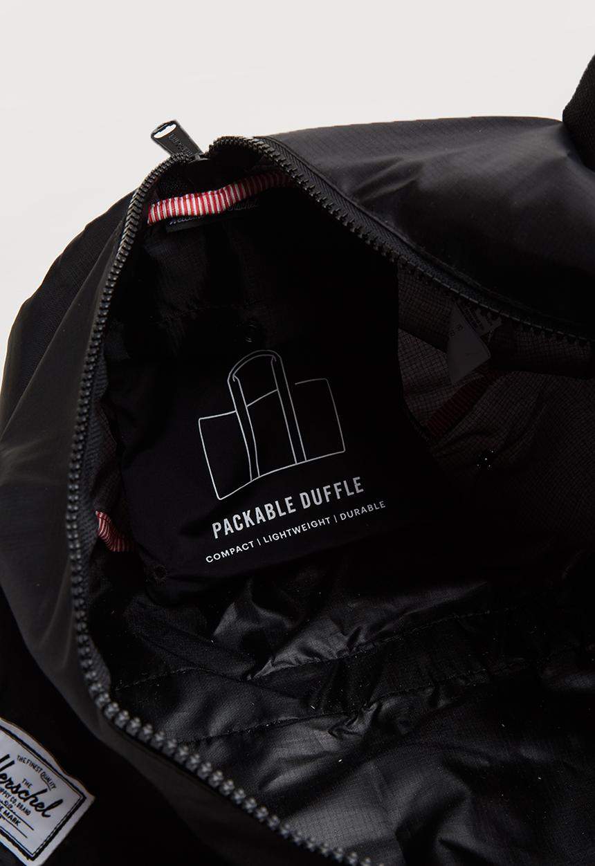 HERSCHEL - Packable duffle bag - black