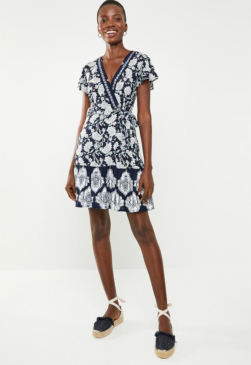 Revenge - Wrap over floral dress with contrast border - navy