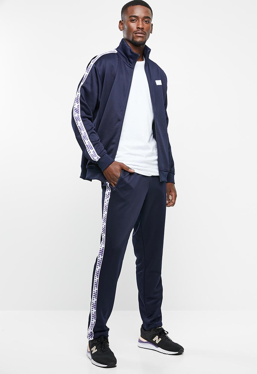 New Balance  - N pack track pant - navy