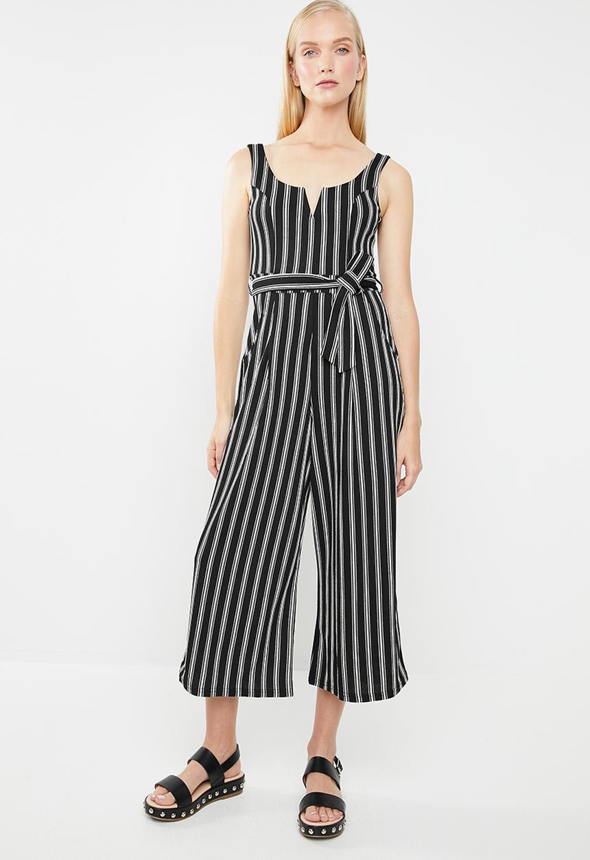 Revenge - V-front cut-out striped print jumpsuit - black & white 