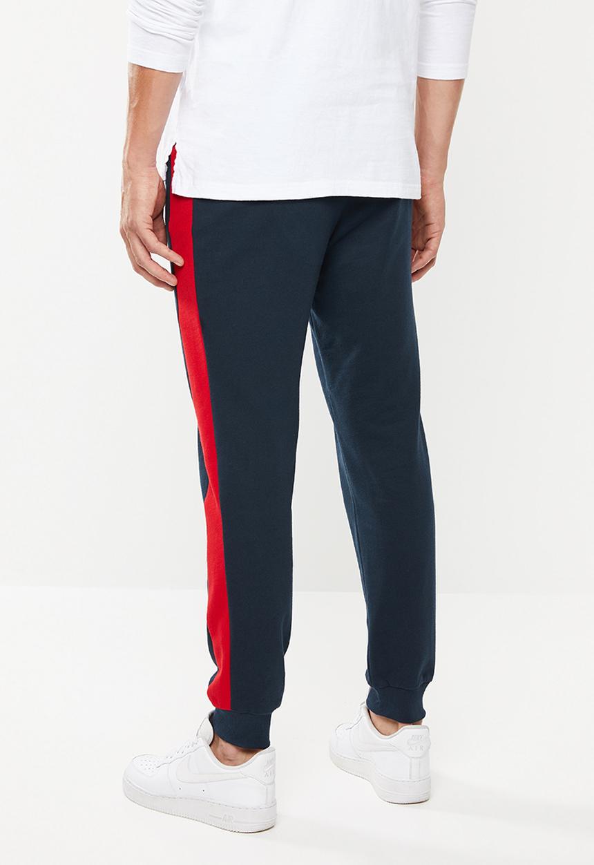 Superbalist - Skinny side stripe sweatpants - navy & red 