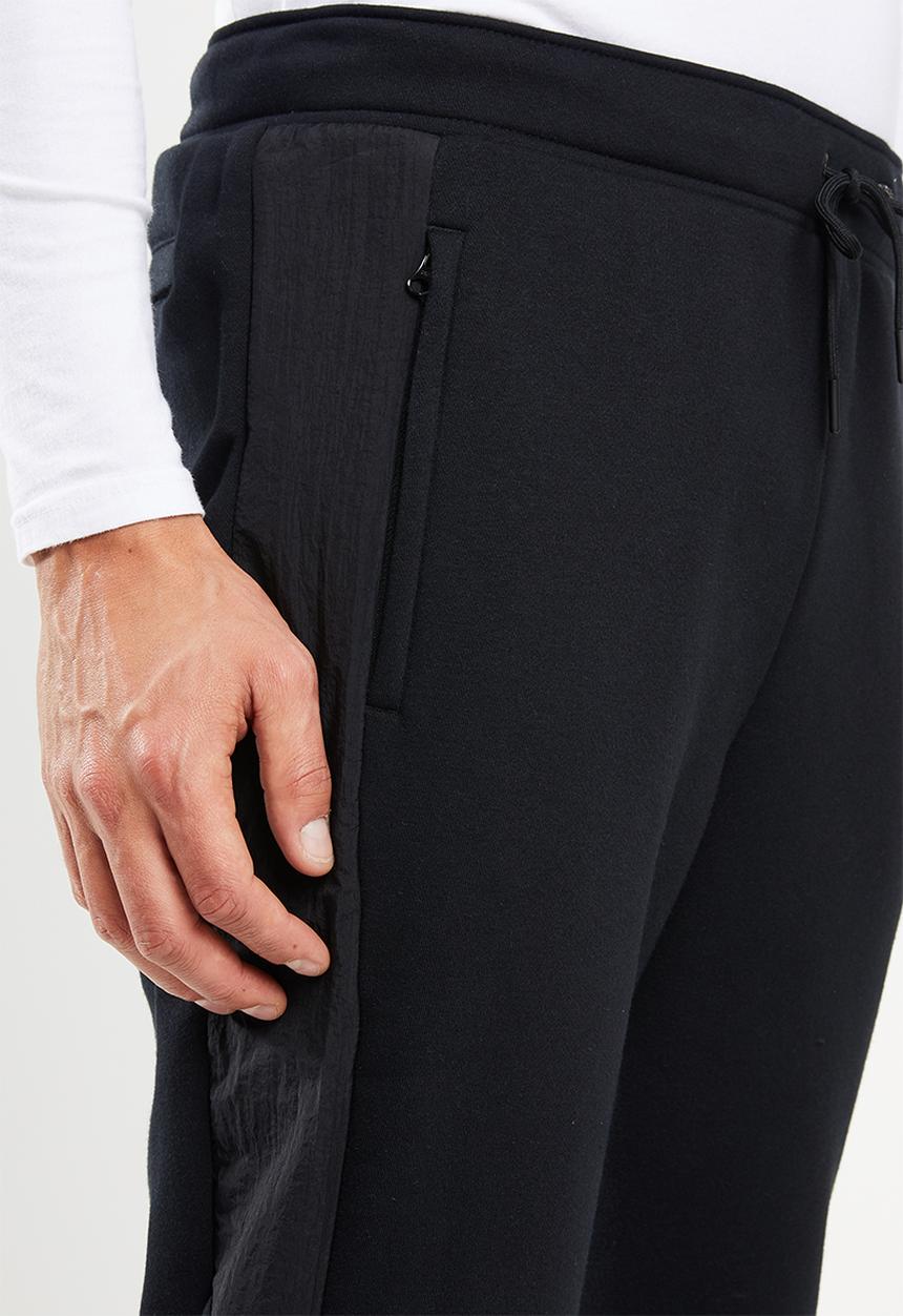 New Balance  - Optiks  track pant - black