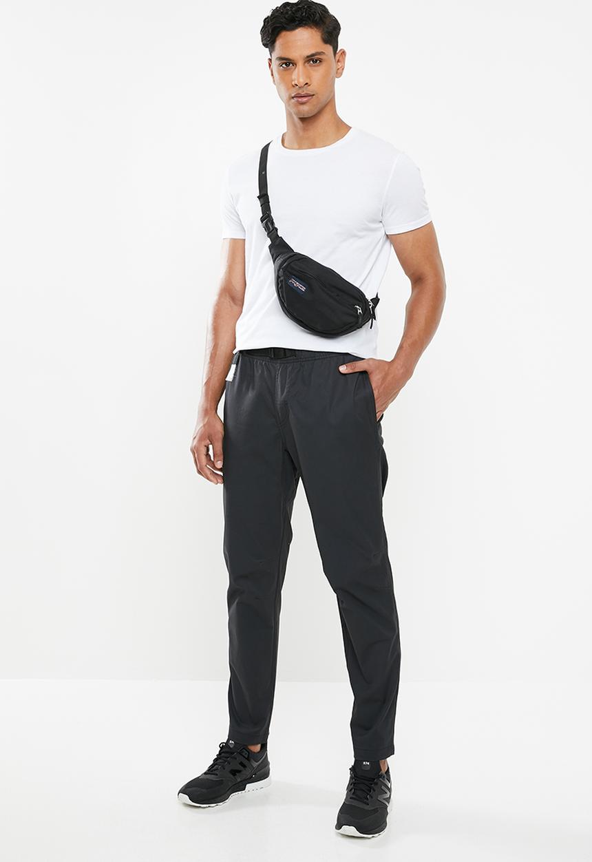 New Balance  - New Balance  athletics woven pant - black 