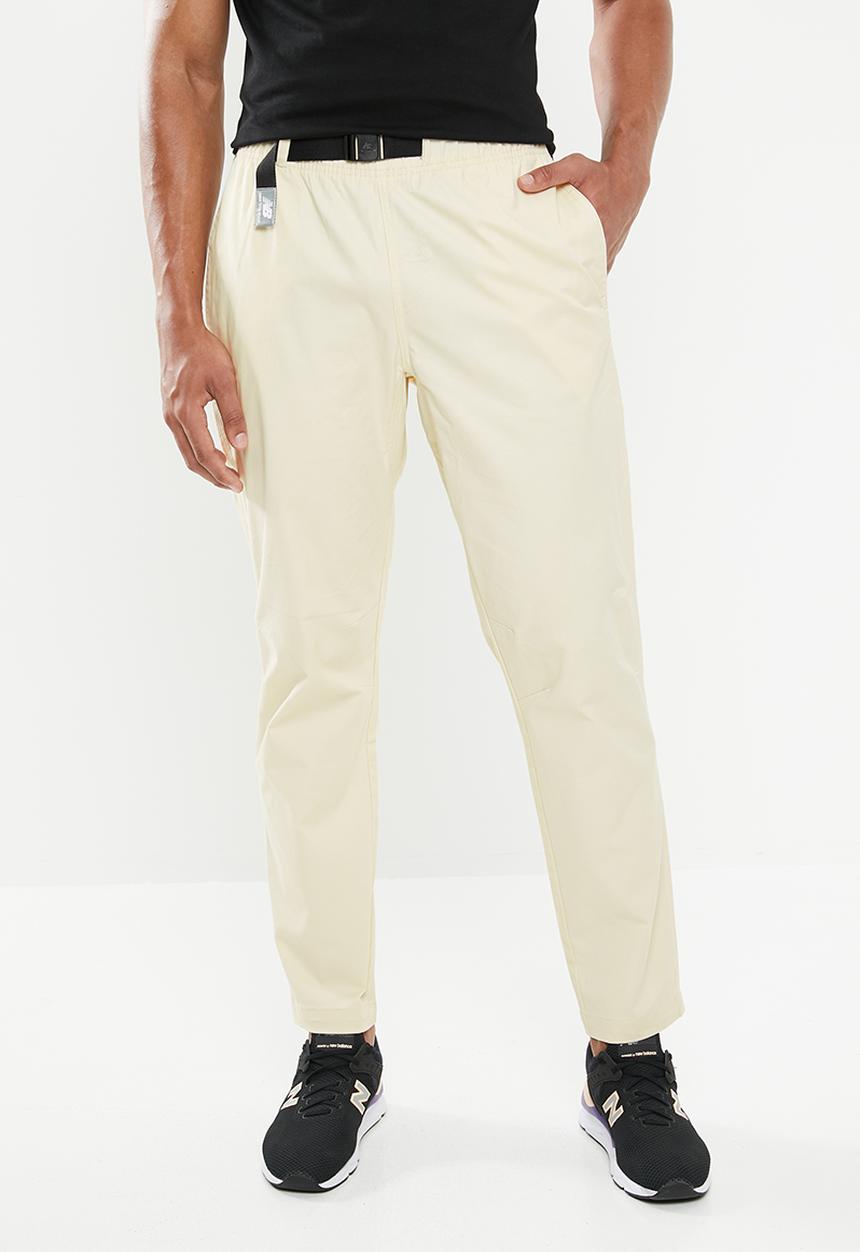New Balance  - New Balance  athletics woven pant - beige 
