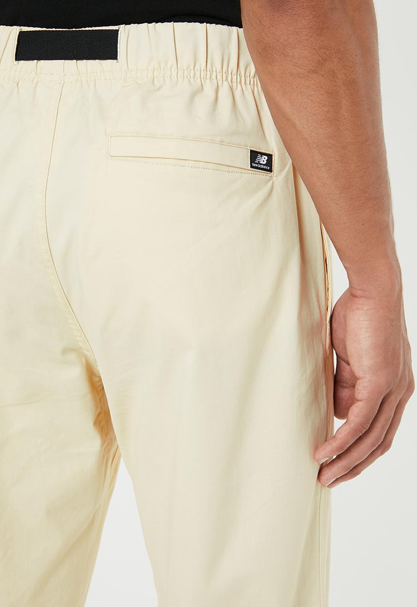 New Balance  - New Balance  athletics woven pant - beige 