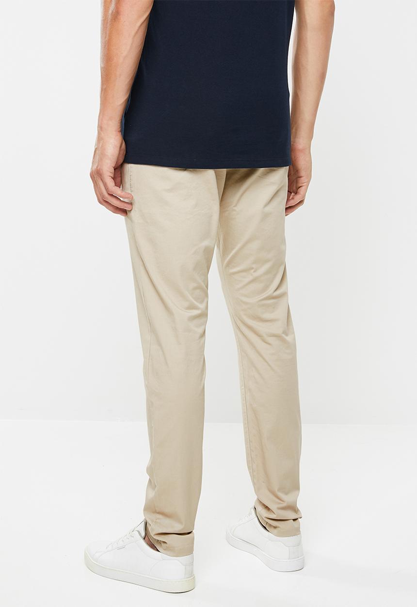 GUESS - Fashion chino pants - beige 