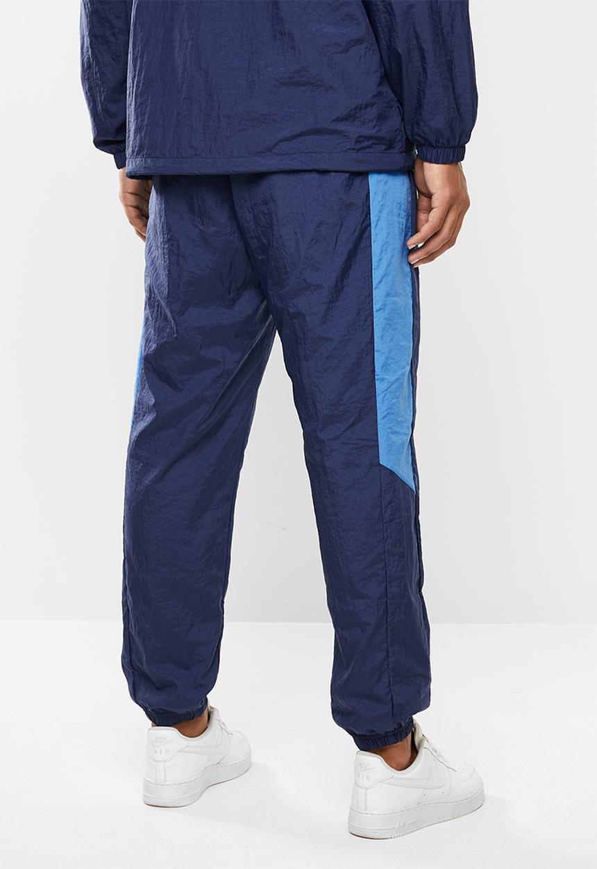 Nike - Nsw woven cf pants - midnight navy/pacific blue/white