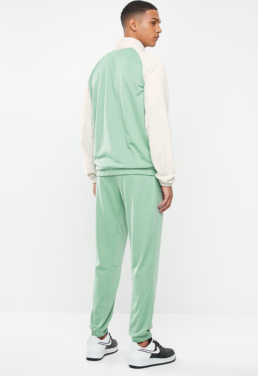 Nike - Nike sportswear ce tracksuit- light bone/silver pine/white