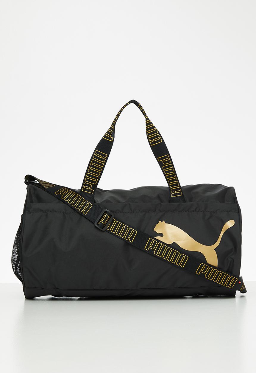 PUMA - AT ESS barrel bag - puma black & metallic gold